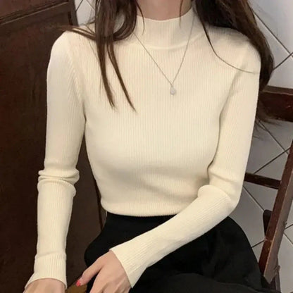 KnitAura Sweater: Slim mock neck knit with vintage charm and cozy elegance.